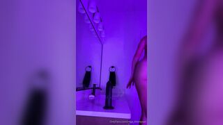 vega thompson rides her big black toy with neon lights
